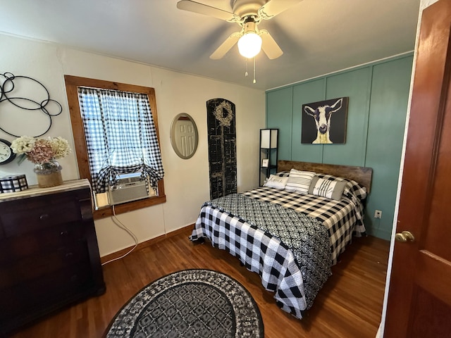 bedroom with cooling unit, ceiling fan, and wood finished floors