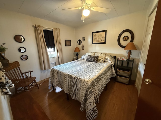 bedroom with a ceiling fan and wood finished floors