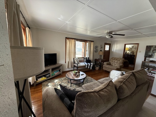 living room with wood finished floors and ceiling fan