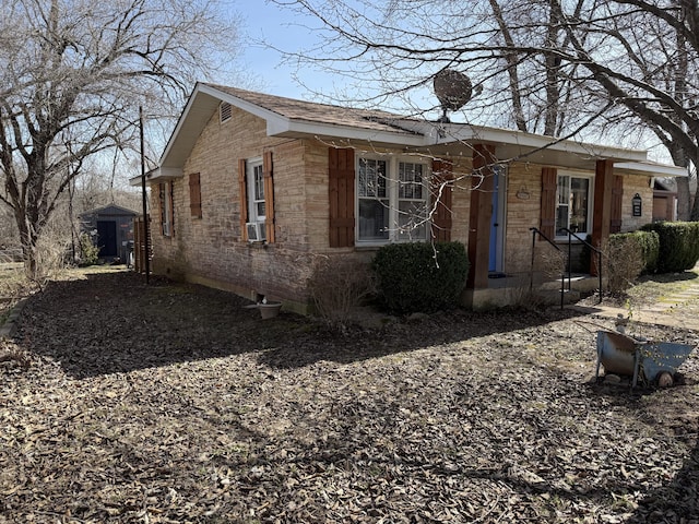 view of home's exterior featuring an outbuilding and stone siding