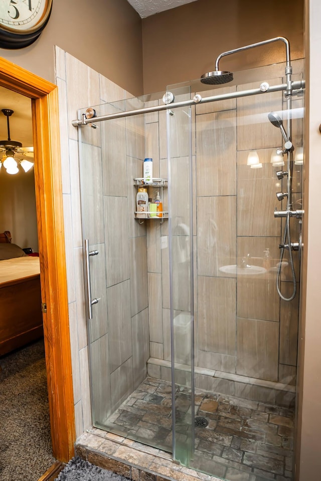 full bathroom with a shower stall and ensuite bathroom