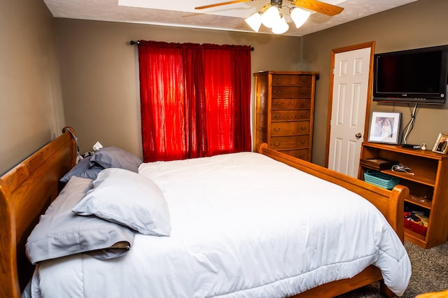 bedroom featuring a textured ceiling and ceiling fan