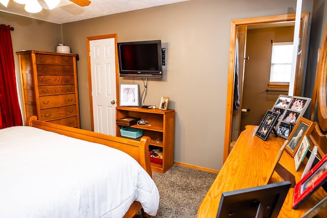 bedroom with carpet flooring, ceiling fan, and baseboards