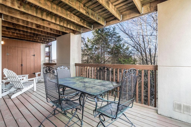 wooden deck with outdoor dining space