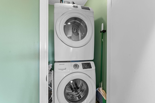 laundry area with laundry area and stacked washing maching and dryer