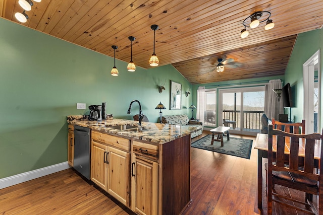 kitchen featuring a sink, dishwasher, vaulted ceiling, a peninsula, and dark wood-style flooring