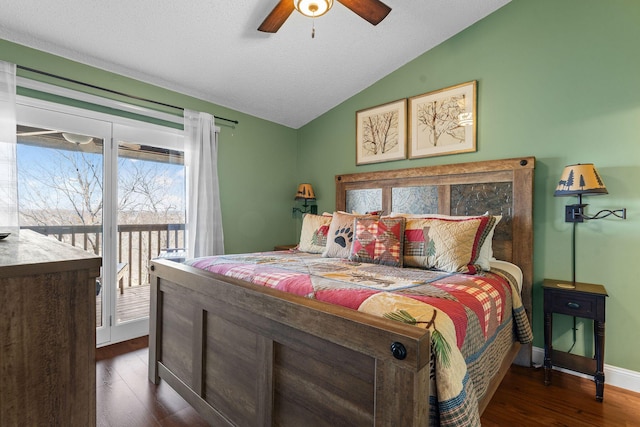 bedroom with a ceiling fan, dark wood finished floors, baseboards, access to exterior, and vaulted ceiling