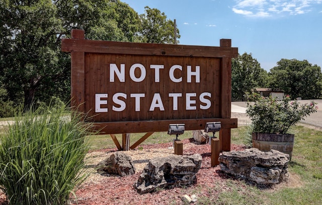 community / neighborhood sign with a detached garage