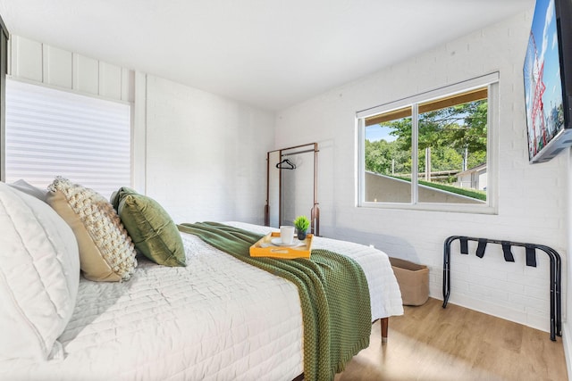 bedroom featuring light wood-style flooring