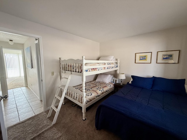 bedroom featuring carpet flooring and baseboards