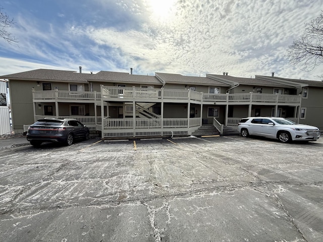 view of property featuring uncovered parking