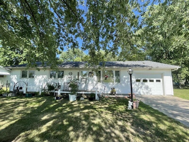 single story home with concrete driveway, an attached garage, and a front lawn