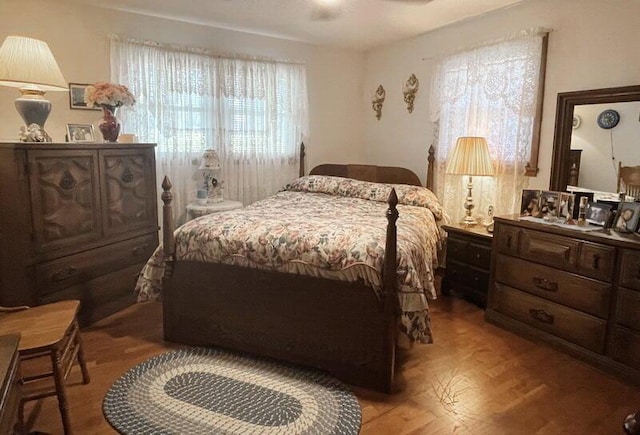 bedroom with wood finished floors