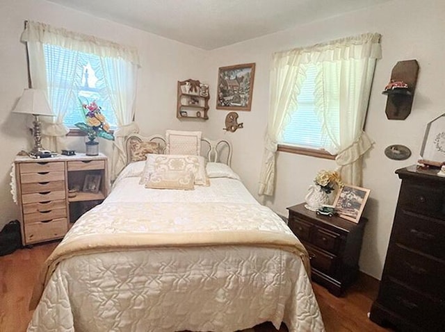 bedroom featuring dark wood-type flooring