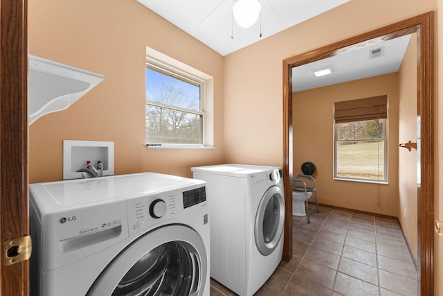 washroom featuring visible vents, separate washer and dryer, a healthy amount of sunlight, and laundry area