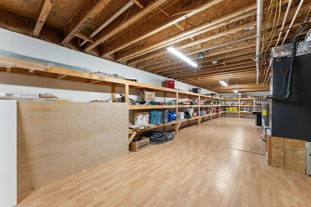 unfinished basement with wood finished floors