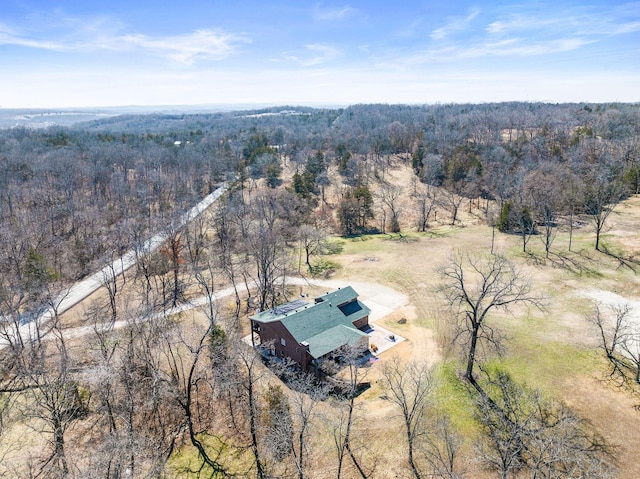 aerial view featuring a wooded view