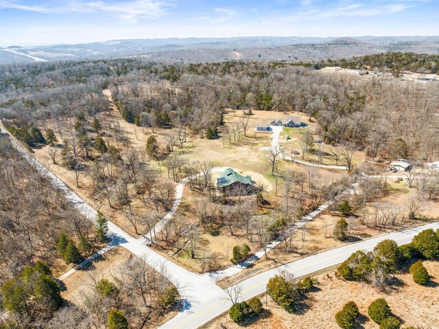 bird's eye view featuring a view of trees and a mountain view