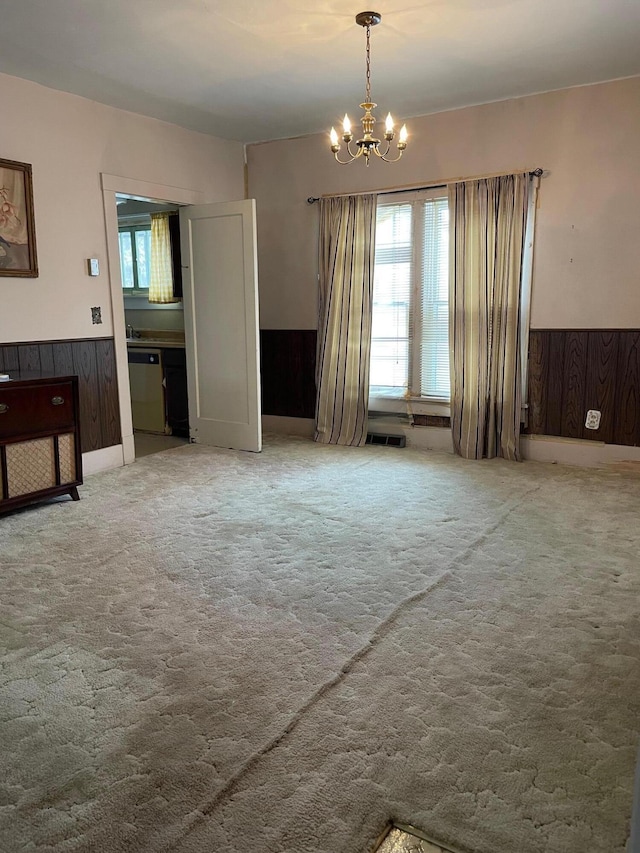 104 N High St, Neosho, MO 64850 - interior space featuring plenty of natural light, wood walls, and wainscoting