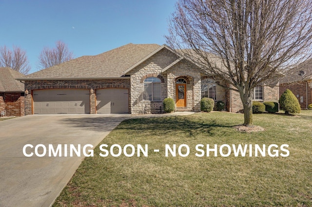 french country inspired facade featuring brick siding, driveway, a front yard, and a garage