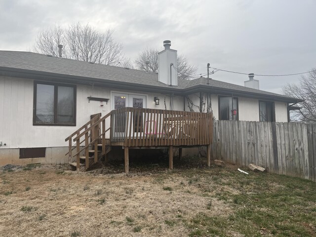 3494 S Christy Ct, Springfield, MO 65807 - back of property featuring fence, a deck, a chimney, and a shingled roof