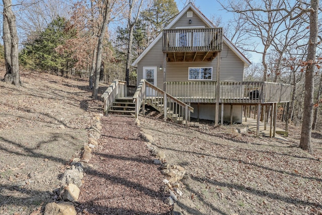 view of front facade featuring stairway and a deck