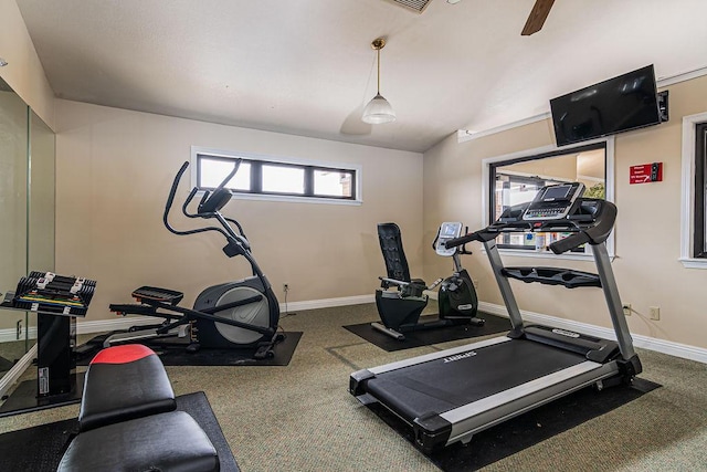 exercise area with baseboards and lofted ceiling