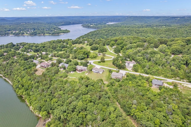 bird's eye view with a forest view and a water view