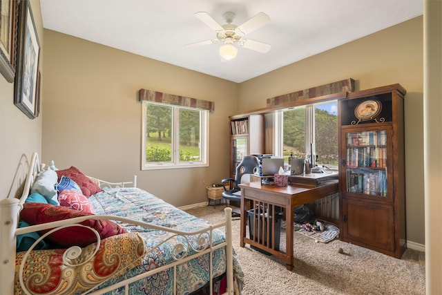 carpeted bedroom with baseboards