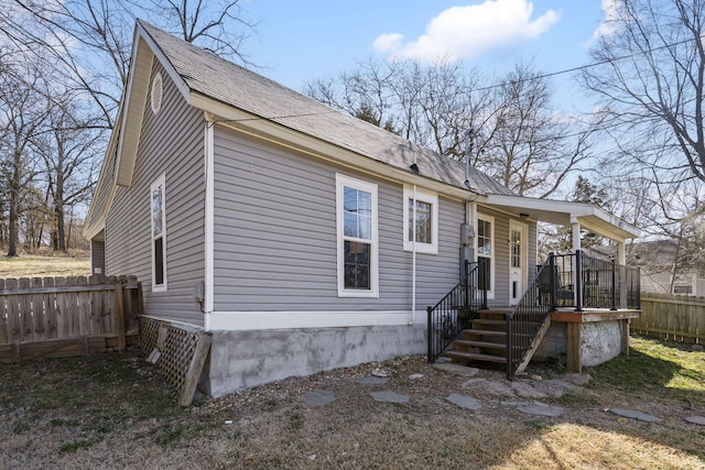 view of front of property featuring fence