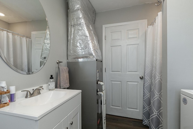 bathroom with vanity and wood finished floors