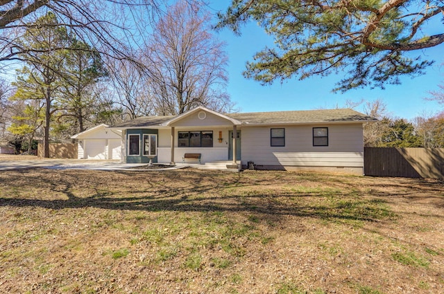 ranch-style home featuring crawl space, a garage, a front yard, and fence