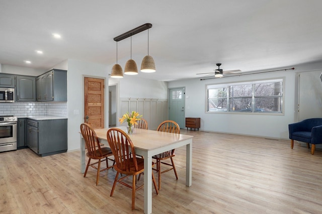 dining room featuring recessed lighting, a ceiling fan, and light wood-type flooring