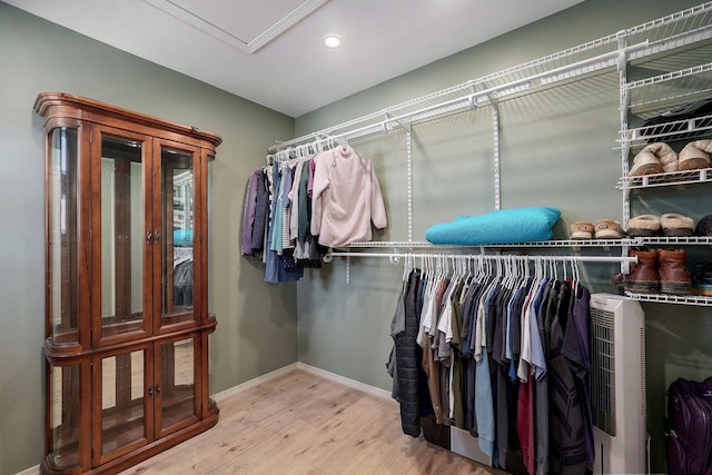 spacious closet with wood finished floors