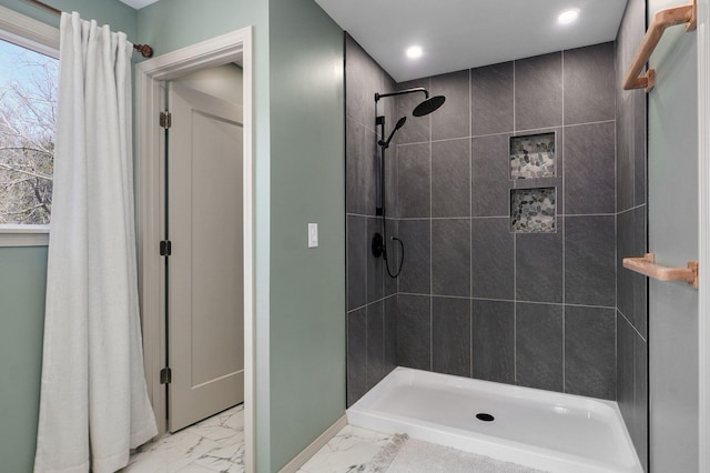 full bathroom featuring recessed lighting, baseboards, marble finish floor, and a tile shower