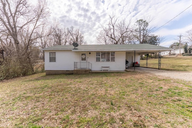 view of front of home featuring an attached carport, driveway, and a front lawn