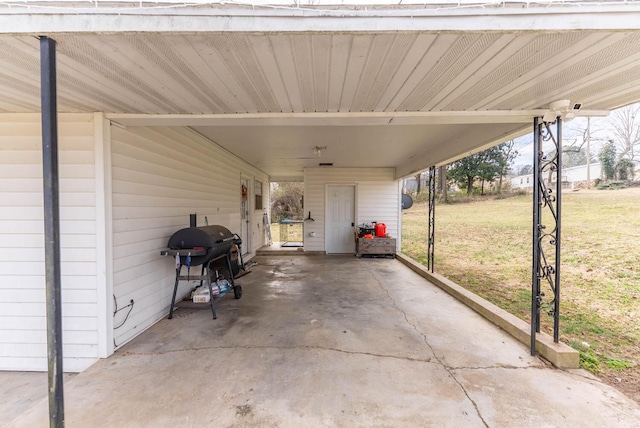 view of patio with area for grilling and an attached carport