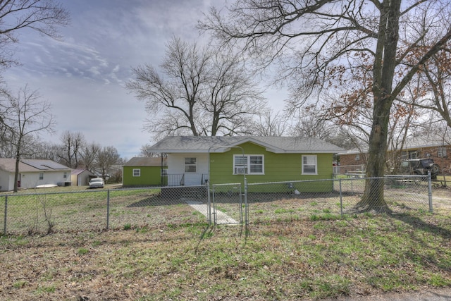 view of front of home with a gate, a fenced front yard, and a shingled roof