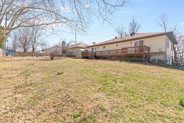 view of yard featuring a deck, cooling unit, and fence