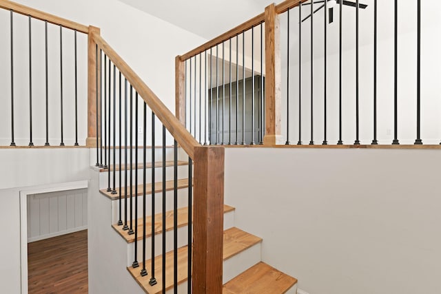 stairway with wood finished floors