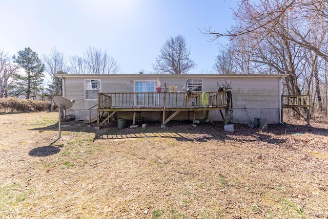 view of front of house featuring stairway and a deck