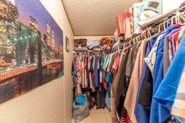 spacious closet with tile patterned floors