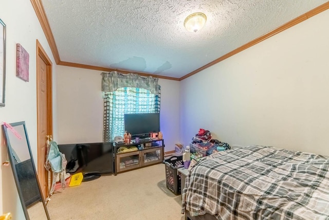 bedroom with crown molding, carpet floors, and a textured ceiling