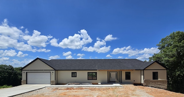 214 Grand Pointe Lot 5, Branson, MO 65616 - ranch-style home featuring an attached garage, concrete driveway, and stone siding