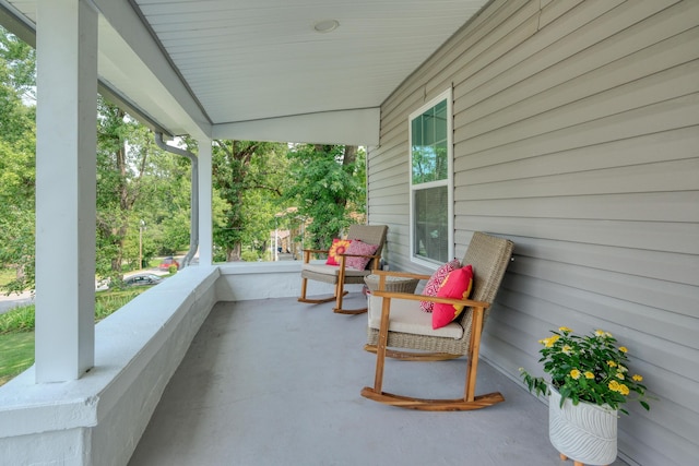 view of patio featuring a porch