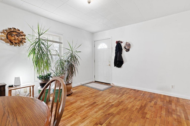 entrance foyer with light wood-type flooring and baseboards