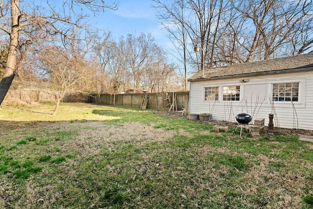 view of yard with a fenced backyard