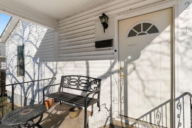 property entrance featuring covered porch