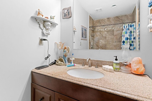 bathroom featuring visible vents, vanity, and a shower with shower curtain