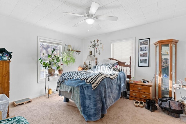 bedroom featuring baseboards, carpet floors, and ceiling fan